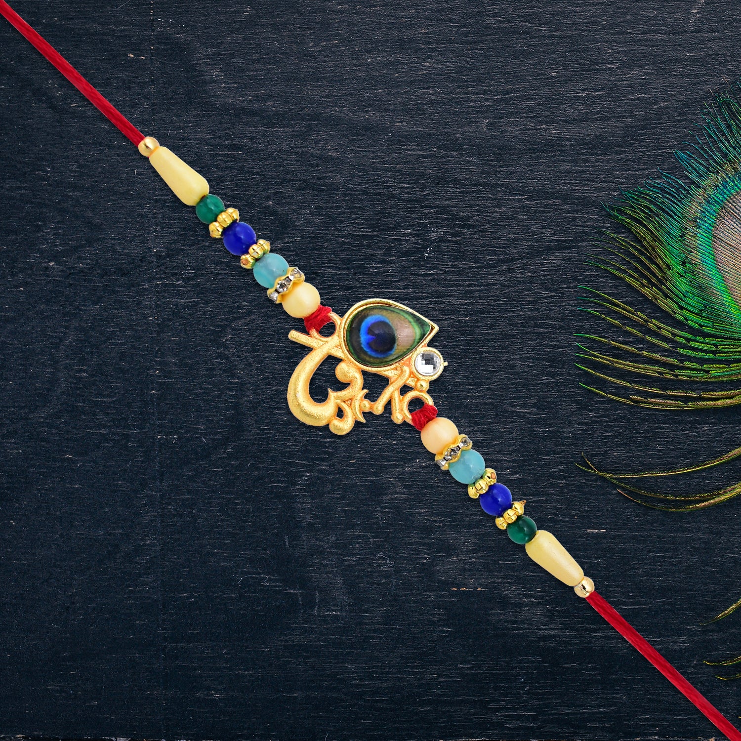 Divine Govind Rakhi With Peacock Feather Design And Multicolor Beads Divine Govind Rakhi With Peacock Feather Design And Multicolor Beads